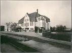 Stationen anlades 1879.
Pingstaftonens förmiddag 1910 brann stationen ned till grunden tillsammans med Hotell Drott, Lilla Hotellet och Järnvägshotellet. Stationsbyggnaden var från sitt ursprungliga skick påbyggd med en våning, samt en farstu norrut. 1912 stod det nya stationshuset färdigt. Intill dess användes en reservstation i en fastighet som tillhörde DJ och som låg vid spårområdet på södra sidan. 
DJ , Dalslands Järnväg