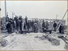 Ombyggnad av malmutskeppningsbryggan på Svartön invid Luleå. Vintern 1906-1907. Betongkaj på pålar. Dykararbete efterverkställd palning. Övriga arbeten nedläggning, borrning och fastbultning av långföljare, bjälkar mm.