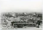 Söderhamn före branden 1876 . Rådhuset  I  och gamla banans stationshus II  är igenkännliga.