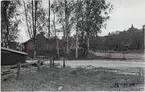 Hudiksvall, plats för bussgarage 1938-05-20,  järnvägsövergång med Ljussignal och järnvägsbommar.