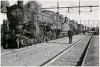 Ånglok på bangård. Ort okänd.