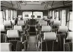 Interiör från en kombinerad linje- och turistbuss.