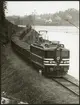 Trafikaktiebolaget Grängesberg - Oxelösunds Järnvägar, TGOJ malmtåg på linjen mellan Grängesberg och Oxelösund april 1967.