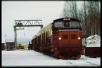 Godståg med containerlast draget av lokomotor Z66 614.