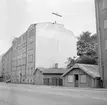 Ännu 1973 stod Malkus Anderssons lilla handelsbod med uthus kvar som miniatyrer invid Djurgårdsgatan. 
Dokumentation av Östergötlands museum inför rivning.