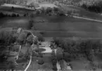 Flygfoto över Lundboholm vid Bor i Värnamo Kommun, Jönköpings län. Nr: 325/1957