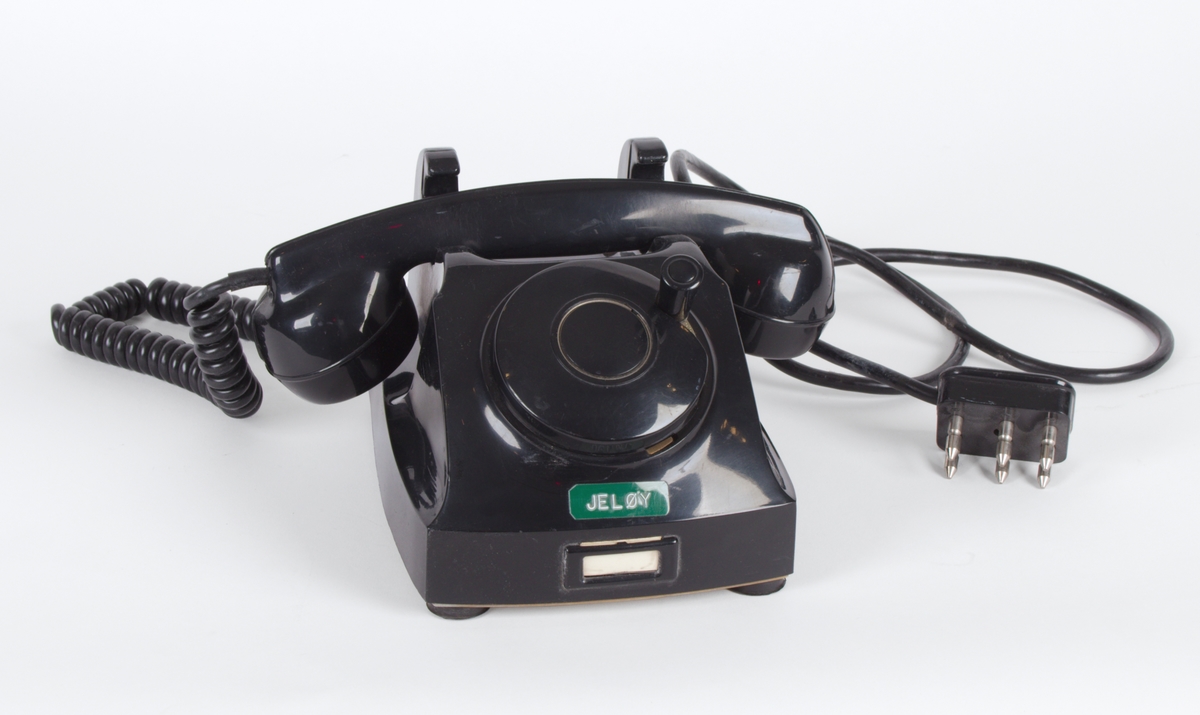 Sort, manuell telefon med sveiv.