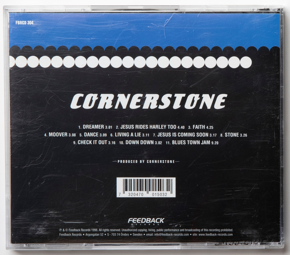 CD-skiva med musik med gruppen Cornerstone. Skiva i tredelat, hårt plastfodral med booklet (häfte) i framsidan och inlaga i baksidan. På framsidan sitter orange prislapp märkt "Kr 50.00".

Innehåll:
1. Dreamer
2. Jesus rides Harley too
3. Faith
4. Moover
5. Dance
6. Living a lie
7. Jesus is comming soon
8. Stone
9. Check it out
10. Down down
11. Blues town jam

JM 55284:1, Skiva
JM 55284:2, Fodral
JM 55284:3, Booklet