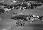 Flygfoto över Bäckaby i Vetlanda kommun, Jönköpings län.  Nr: 245/1959