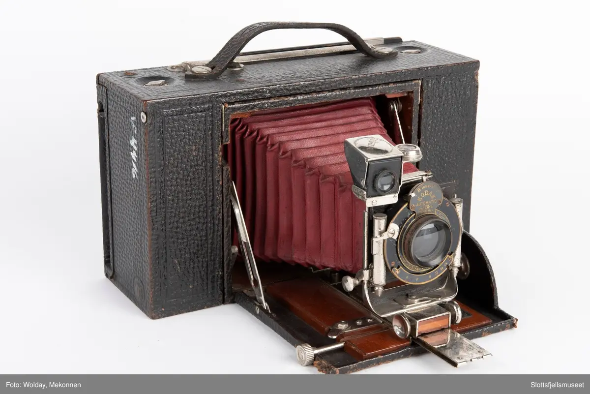 Kombinert apparat for plater og rullefilm