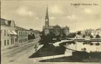 Vykort med motiv över Bünsowskatjärnen med Gustav Adolfs kyrka i bakgrunden.