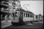 Vid hållplats på linje 15E mellan Norra Bantorget - Råsundahallen - Esplanaden står Aktiebolaget Stockholms Spårvägar, SS A 12 347 med släpvagnar.