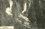Vykort med motiv över Brattfallet vid Oxsjön i liden. Vykortet bär texten 15 minuters gång från båten.
