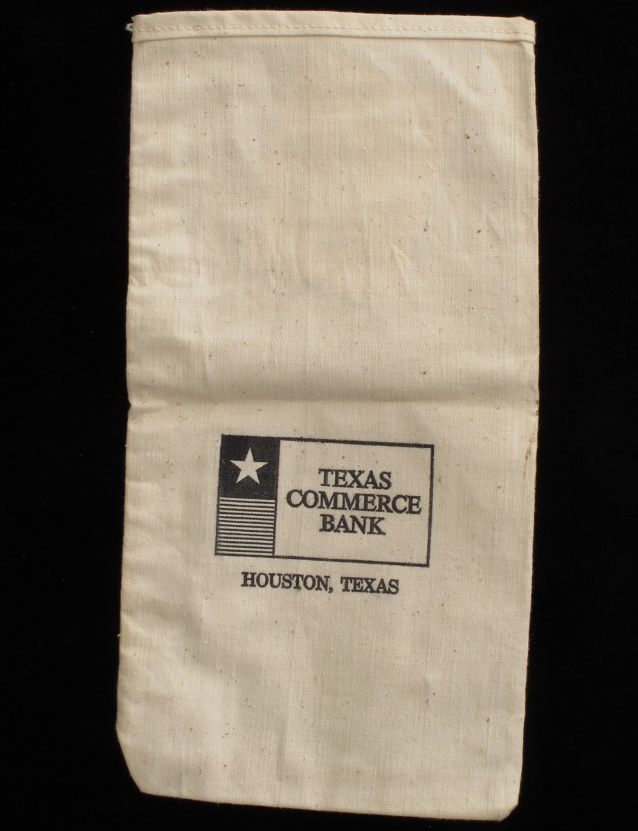 Pose av bomullslerret. Med påmalt tekst i sort:  Texas Commerce Bank / Houston, Texas