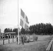 Svenska Flaggans Dag på Rocksjövallen. Flaggan hissas/halas.