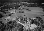 Flygfoto över Ökna i Vetlanda kommun, Jönköpings län. 750/1964