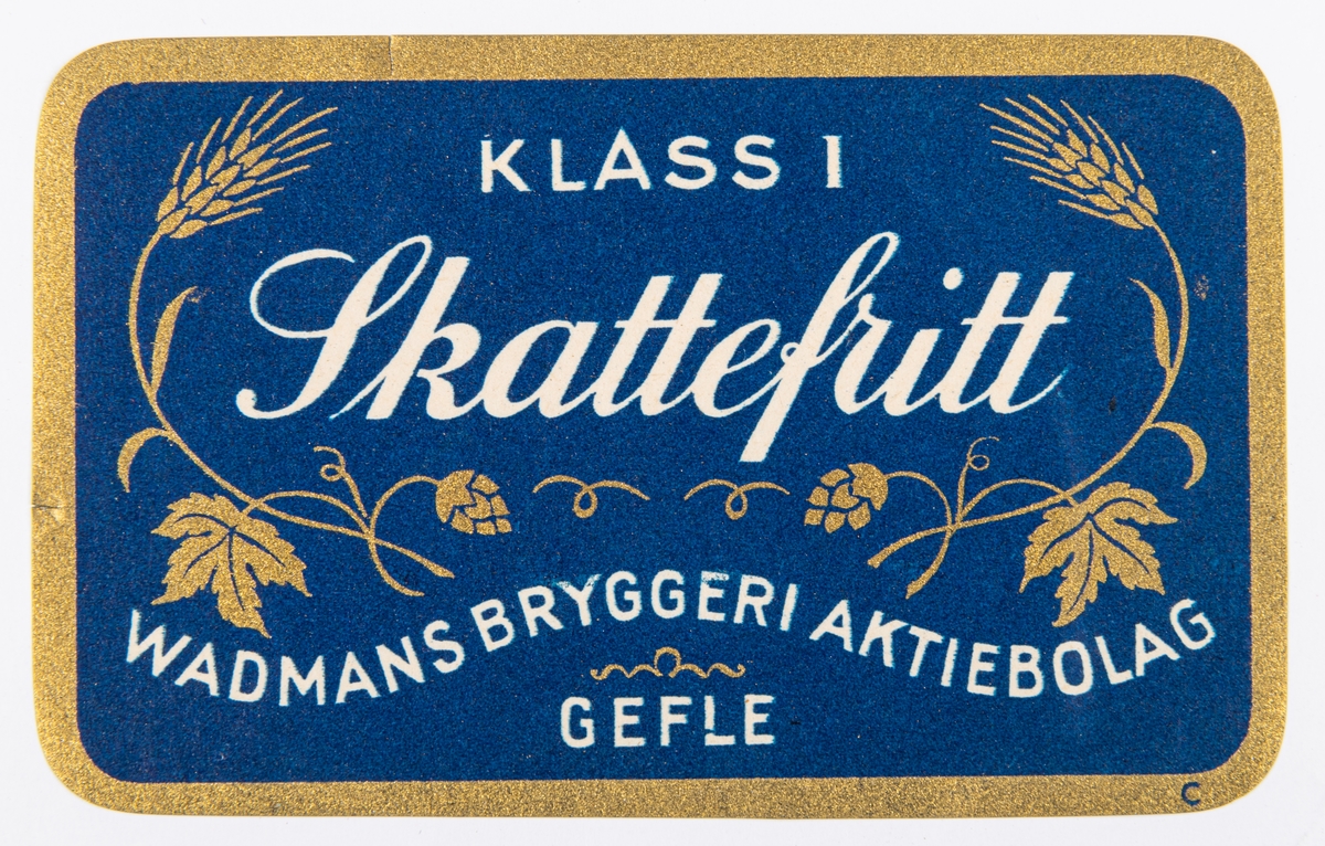 Etiketter. Rektangulära med avrundade hörn. Blå, guld, vit. "KLASS I Skattefritt WADMANS BRYGGERIAKTIEBOLAG GEFLE".