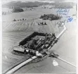 Skerike sn, Västerås.
Flygfoto över gårdar söder om kyrkan, 1970.