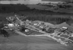 Flygfoto över Askeryd i Aneby kommun. Jönköpings län. 1309 / 1966