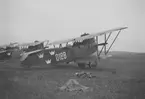 Flygplan Phönix C.I Dront nummer 128 står på ett flygfält vid flygdagen på Bulltofta den 5 september 1926.