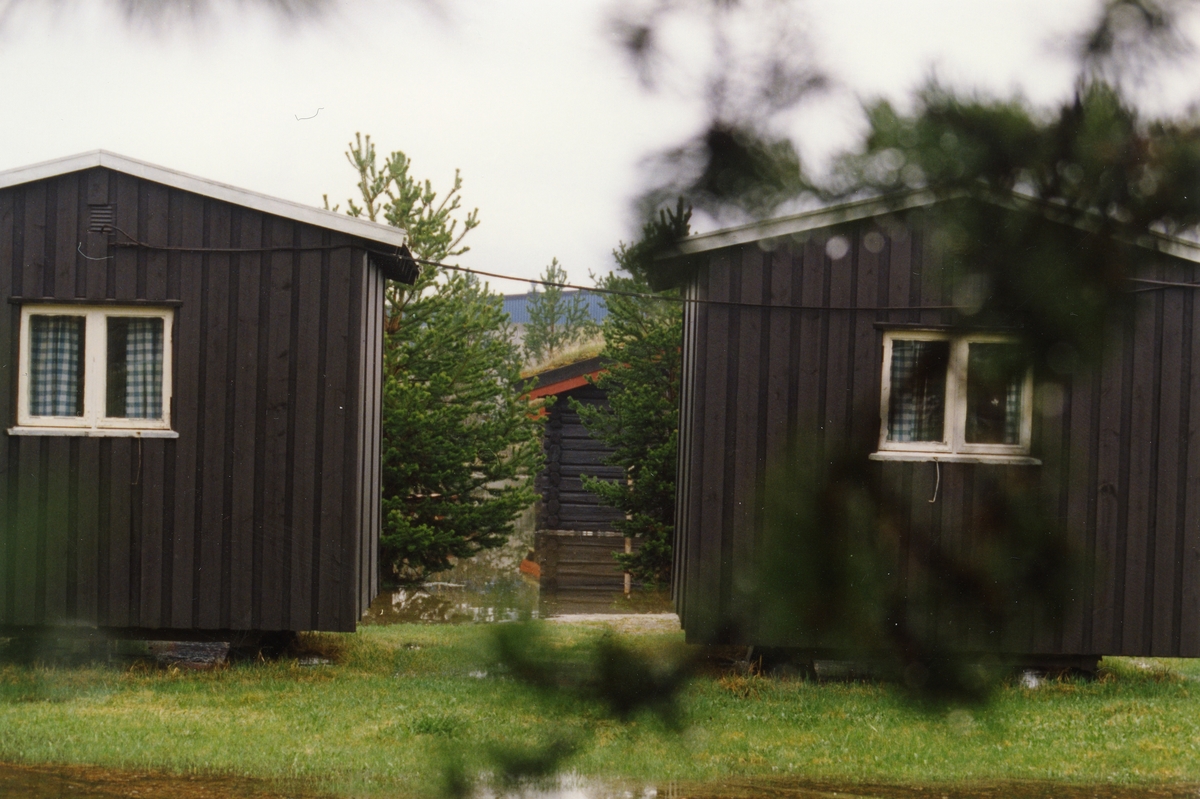 Flom-bilder. Campinghytter under vann