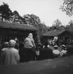 Festlighet vid Laxbrostuga, Skansen. Troligen allmogbröllop.