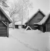 Vinterbilder på gårdar, ute och inne. Skansen.