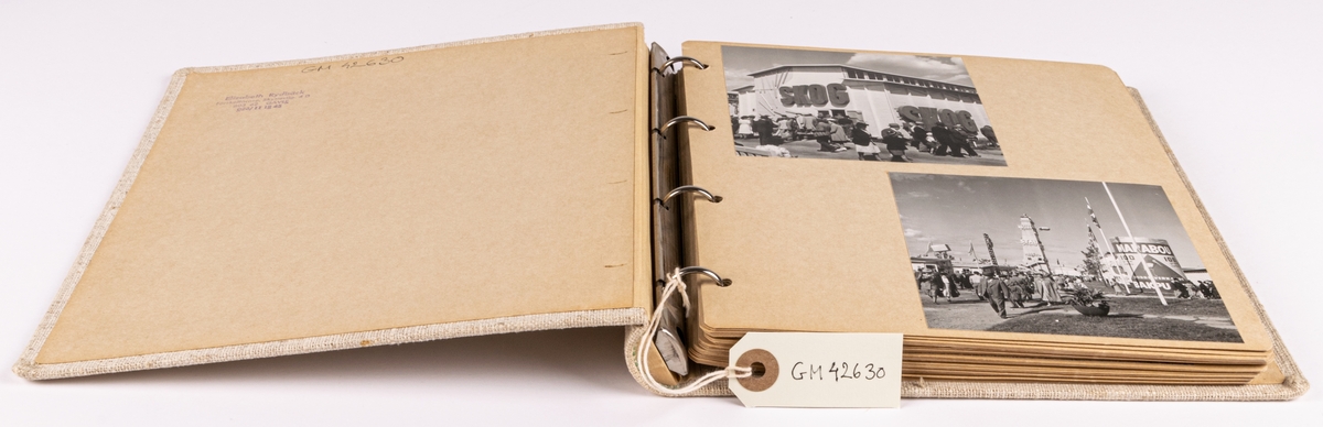 Fotoalbum innehållande fotografier från Gävleutställningen1946. Klädd med beige linneväv samt blad i kartong.