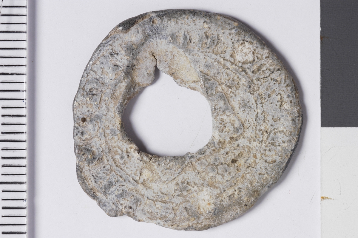 Våpenskjold med ukjent innhold, legende. 