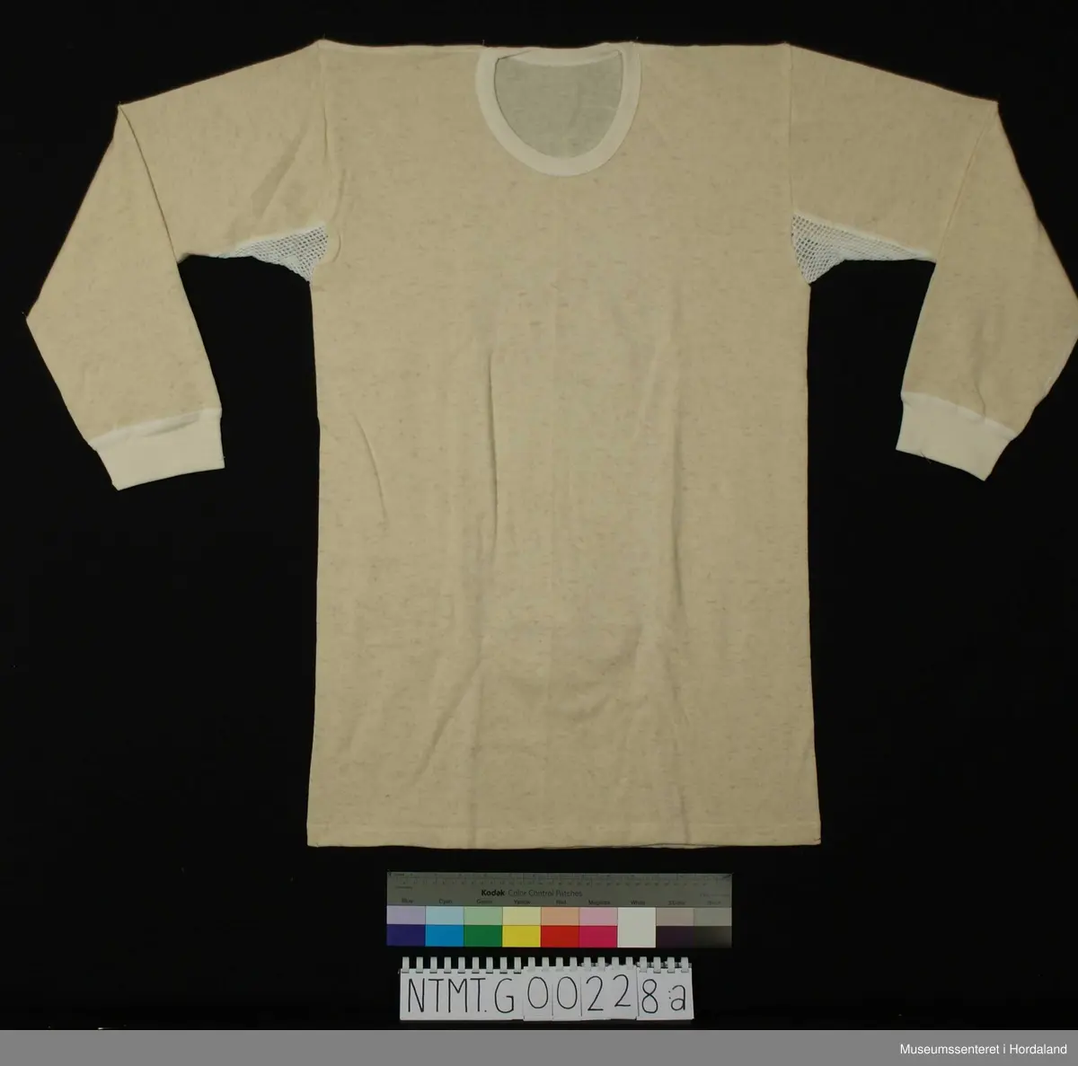 Lange ermer med brotavslutning, rund hals