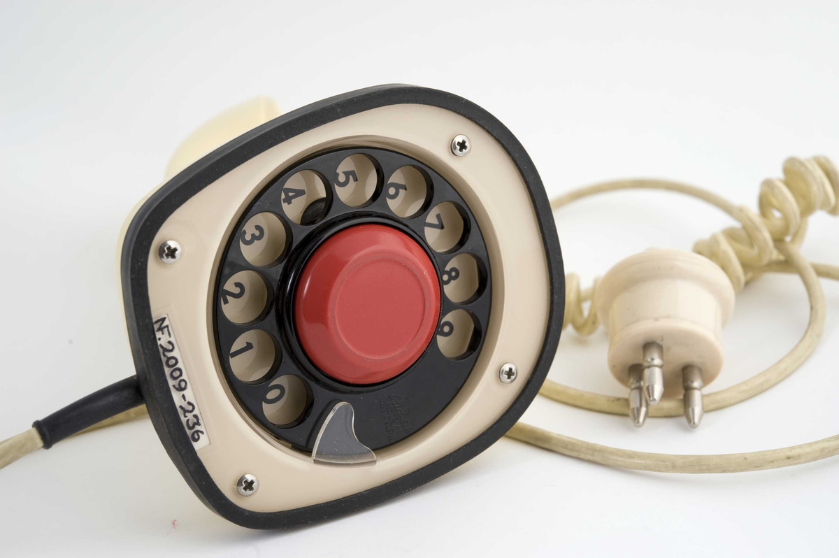 Kremfarget telefon med skjult tallskive