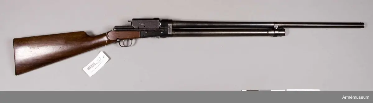 Grupp E IV e.
Automatiskt hagelgevär enligt Sjögrens system. Kaliber 14.
Framstock saknas. Trångborrad pipa.