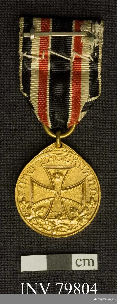 Grupp M II.
Guld jämte miniatyr.
