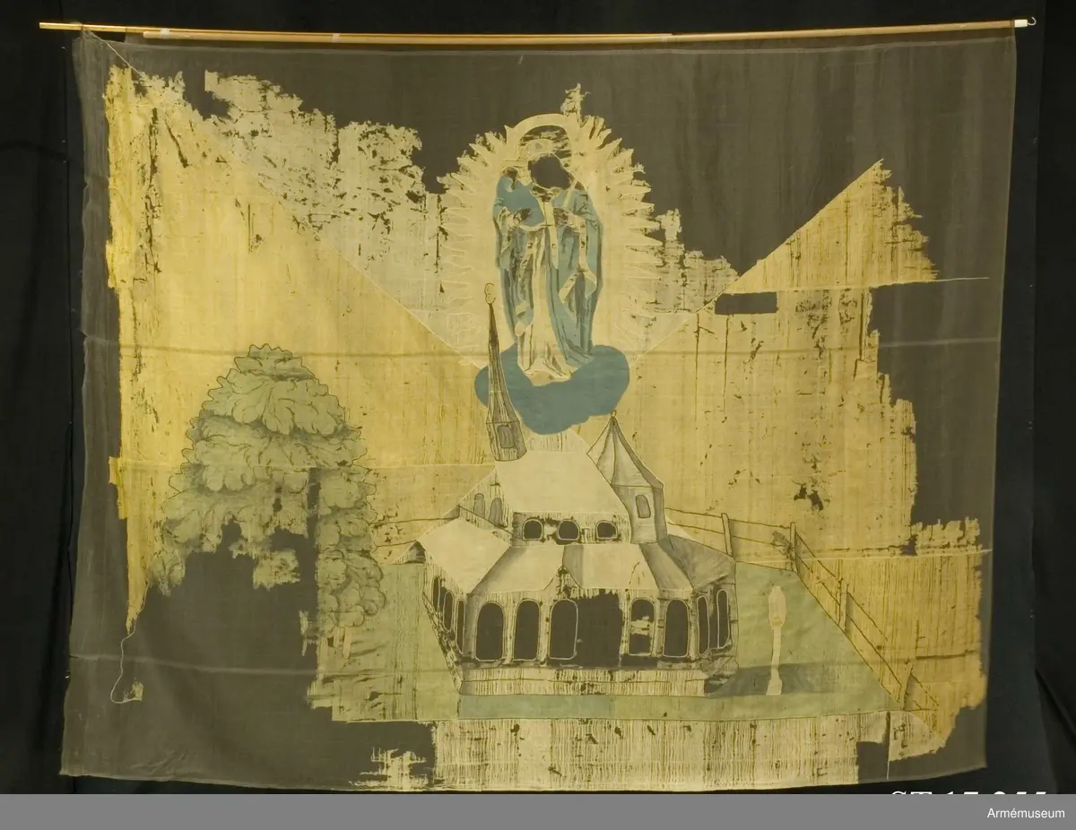 Fyrstyckad duk av gult och vitt siden. Dekor av intarsia föreställande Gnadenkapelle i Altötting, Bayern. Över kapellet svävar jungfru Maria i strålkrans.