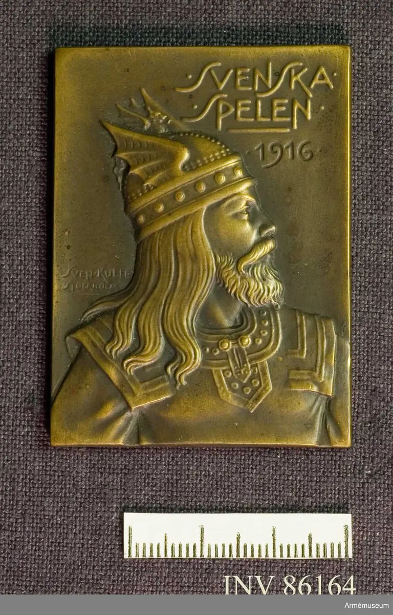 Grupp M II.

Bronsplakett, Svenska spelen 1916. Till Kapten E. Fick som erinran af Svenska spelen 1916. Utförd av Sven Kulle, Stockholm.