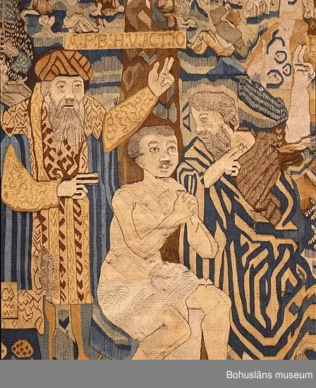 Bildvävnad från tidigt 1600-tal i lin, ull och hår. Flamskvävnad. Scener ur gamla och nya testamentet. I mitten Livets träd på vars vänstra sida återges scener ur gamla testamentet. På trädets högra sida den knäböjande jungfru Maria, Kristus på korset med omgivande bård, troligen efter försättsblad till tysk bibel 1500-talets förra hälft. Troligen nordtyskt arbete.


Ur handskrivna katalogen 1957-1958:
Gustavsbergstapeten
ÄVEN KALLAD GULLMARSBERGSTAPETEN.
DEPOSITION I APRIL 1947 AV GUSTAVSBERGS BARNHEM ENLIGT LAPPKATALOG. 242 x 205 cm.