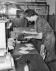 Kassabiträdet Elly Ek, postexpeditionen Åkersberga,
skyddsstämplar postanvisningar.  Foto augusti 1961.