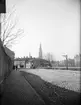 Svartbäcksgatan och gångbron vid Skolgatan, före Haglunds bro, Uppsala 1901