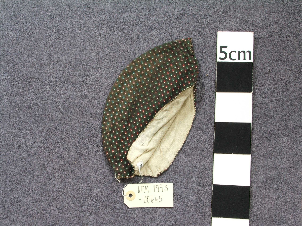 Dråpeformer med kvit prikk nedst i dråpe.