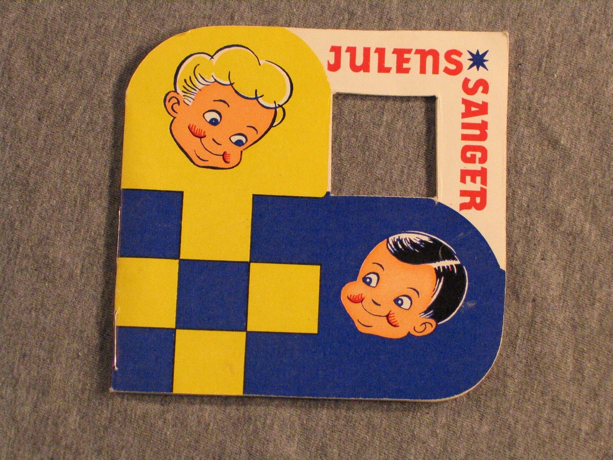 Utforma som ei julekorg i raudt og gult på eine sida, blått og gult på den andre. Teikning av Perle og Bruse, Hansa Bryggeri sine reklamefigurar, på begge sider. Tekst: Julens Sanger. 
Songheftet kan hengast på juletreet. 16 s., 14 songar, m.a. Hansa sin reklamesong "Nissesangen".