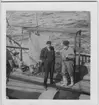 '''Skageraks''expedition 6-10 juni 1939: ::  :: Orvar Nybelin och Leonard Axel Jägerskiöld (till höger) intill ''hönsburen'' (korallskrapan) på båtdäck, fördäck. Stövlar. Pipa. Skärmmössa. Keps. ::  :: Ingår i serie fotonr. 4100:1-10.'