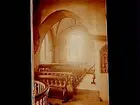 Interiör av Almby kyrka, kyrkbänkar.
Före restaurering.