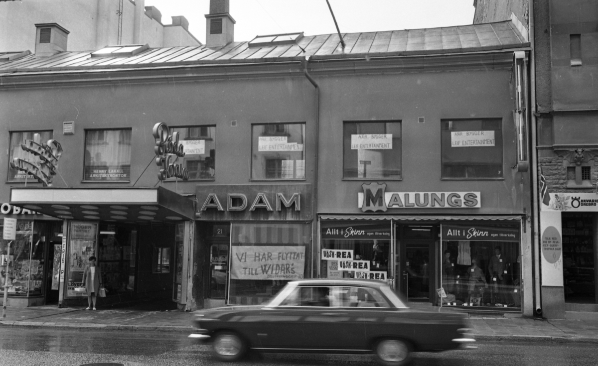 Rubrik till negativbilderna: Morötter. 27 juli 1968.
På bilden biografen Röda Kvarn, Storgatan 21, affärsbyggnader, Adam, Malungs.