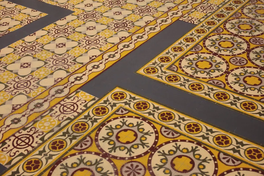 Work on the floor that resembles coloured ceramic tiles, actually made of different spices