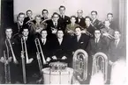 Pingstkyrkans Brassband, början av 1950-talet. Bakre raden: 1. okänd, 2. Sven Söderholm, 3. Birger Dalén, 4. Fredrik Allersmeir, 5. Axel Grahn, 6. Paul Andersson. Andra raden: 1. Sture Widlund, 2. Einar Lilja, 3. Karl-Erik Djurfelt, 4. Hans Jormeus, 5. Jan Logevall, 6. Gunvald Lundqvist. Främre raden: 1. Hans Dalén, 2. Gunnar Jormeus, 3. Bengt Rubensson, 4. Veikko Rülzy, 5. Arne Arrestig, 6. Sam Lithander, 7. Olof Westergren.