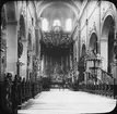 Skioptikonbild med motiv från Obere Pfarrkirche i Bamberg.
Bilden har förvarats i kartong märkt: Resan 1906. Bamberg 8.