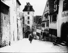 Skioptikonbild med motiv av Cobolzeller Thor i Rothenburg ob der Tauber.
Bilden har förvarats i kartong märkt: Vårresan 1910. Rothenburg. XXV. Text på bild: 