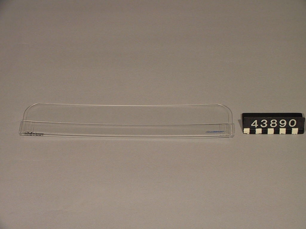 En transparent ficka som fästs på datorskärmens övre del, förvaring för papperslappar.