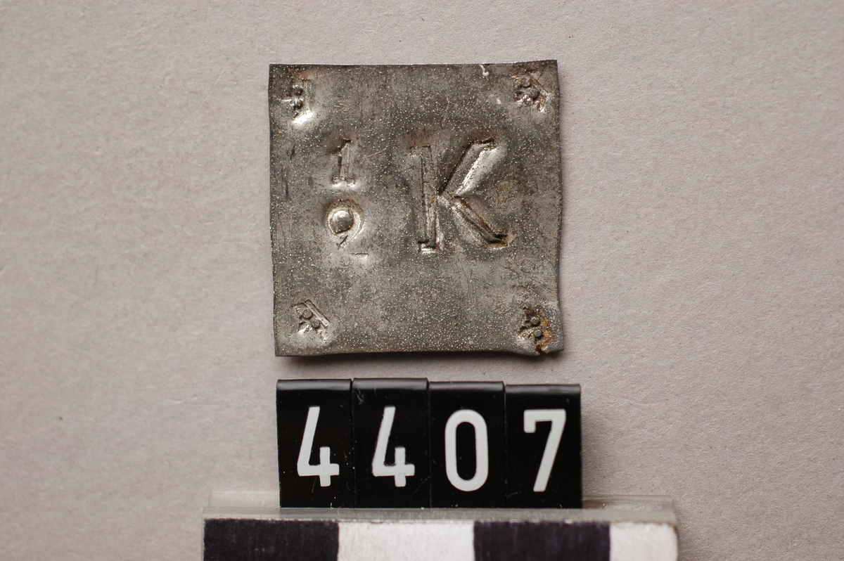 Drickspollett av koppar. märkt: 1/2 K