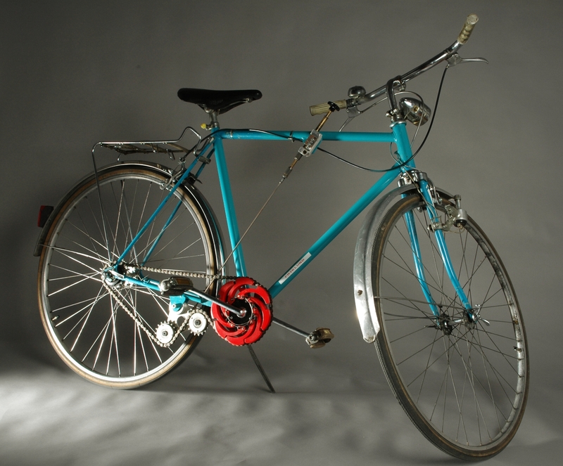 Cykel med steglös kedjeväxel, vars huvudprincip är ett expanderande hjul som anbringats på den utgående axeln.